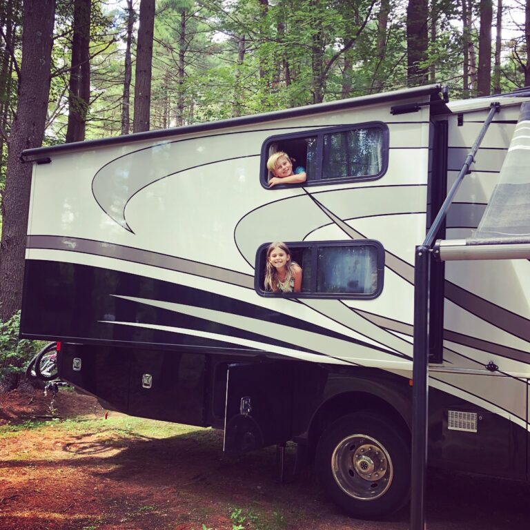 two kids in an RV trailer
