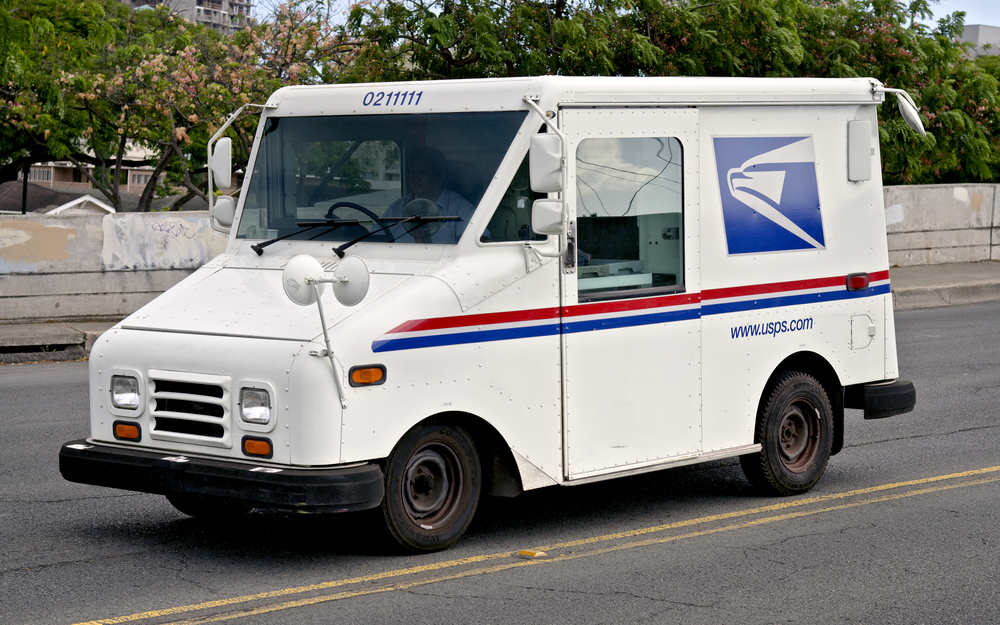 a USPS truck on the road