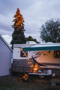 RV awning with string lights at dusk